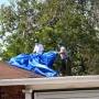 Team members' tarping the roof 