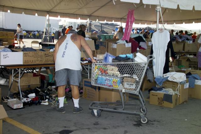 Residents pick up relief supplies at the PRC Compassion Aid Station in Chalmette 