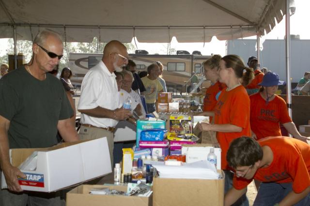 Residents pick up relief supplies at the PRC Compassion Aid Station in Chalmette 