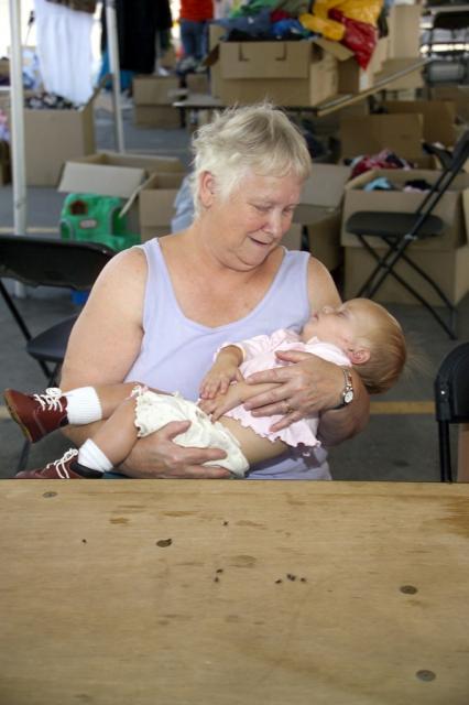 Emma Hall hold Cynthia's 10 month old baby 