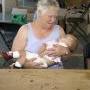 Emma Hall hold Cynthia's 10 month old baby 