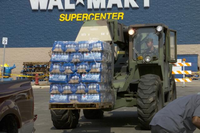The National Guard brings in more relief supplies to the PRC Aid Station 