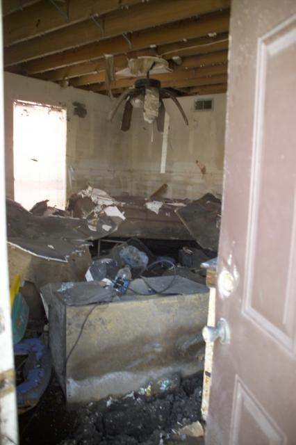 Water completely submerged the first floor of Shirley's apartment (9+ feet). Note the over foot of mud on the floor. 
