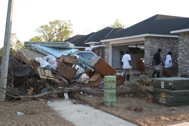 This family worked 22 years to buy this house less than a year before now they are taking all of their possessions to the trash.