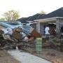 This family worked 22 years to buy this house less than a year before now they are taking all of their possessions to the trash.