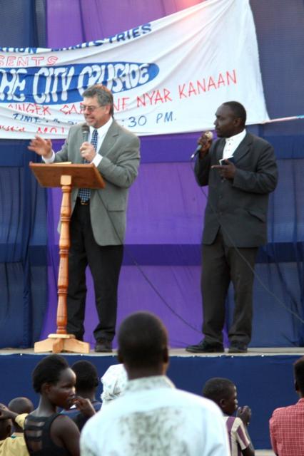 Pastor Terry speaking Pastor Solomon translating during the first night of the Crusade