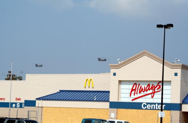 CH-47 Chinook helicopters fly over the PRC Aid Station 