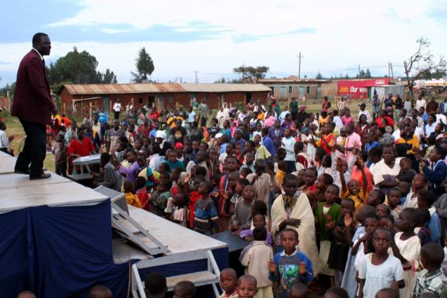 Pastor Mathew speaking to the crowd during the Crusade