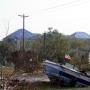  This boat named tsunami ended up on shore… Note the FEMA Blue Tarped roofs in the background in Slidell, LA 