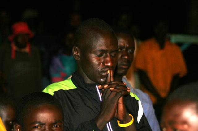 Kenyan long distant runner Isaac Loluka receiving Christ during the Crusade
