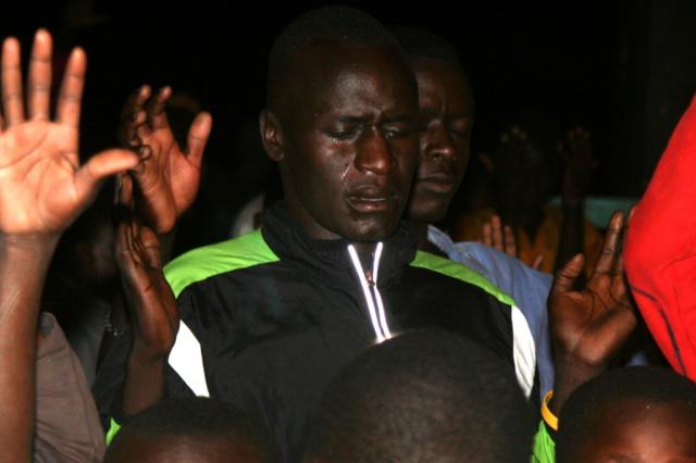 Kenyan long distant runner Isaac Loluka receiving Christ during the Crusade