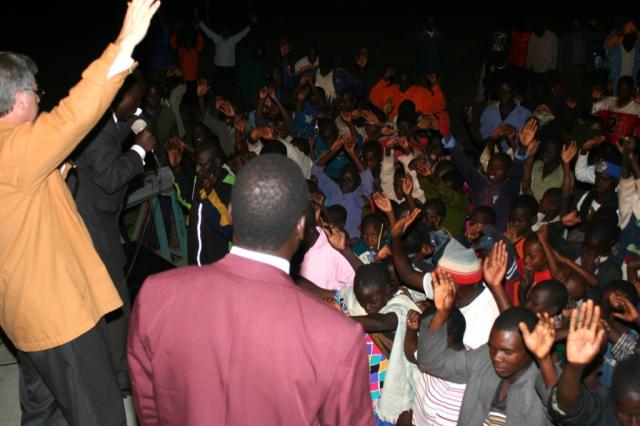 Pastor Terry praying and blessing the crowd of worshiper during the Crusade