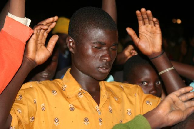 The Men of Eldoret praying during the Crusade 