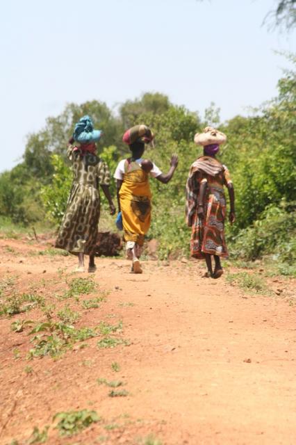 The woman of Homa-bay start making their way home carrying a weeks worth of food on her back.