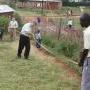 David Campbell, Pastor Terry, and Eric measure a possible site of an orphanage in Eldoret 