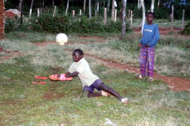 This boy makes a great save using a pair of flip flops as goalie gloves. 
