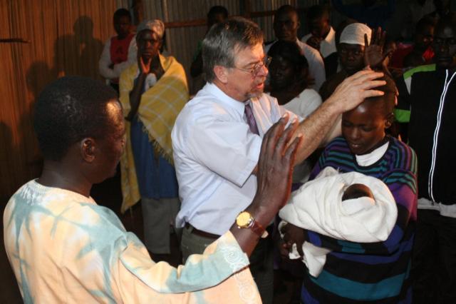 Pastor Terry blesses Pastor Mathew's new granddaughter 