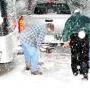 Team members hitch up the trailer loaded with 900 Christmas gifts and other relief supplies. 