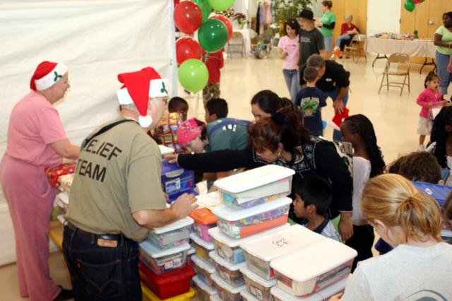 The kids receive their Christmas gifts. 