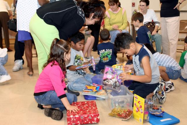 The kids open their gifts. 