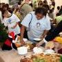 Residents take cookies during the party in Metairie. 