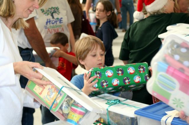 A little boy receives his gift. 