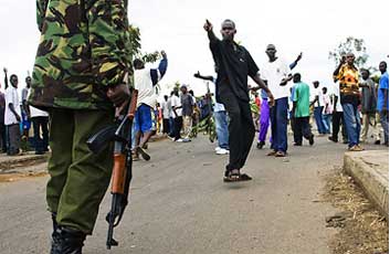 Supporter of Kenya's Opposition taunts a Kenyan policeman during a demonstration in the street of Kisumu, Kenya.