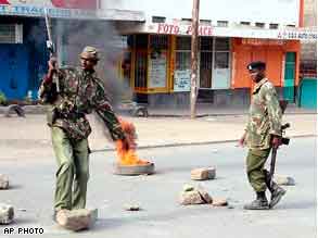 Police attempt to secure a street in Naivasha